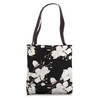 White Magnolias Floral Pattern on a Black Background Tote Bag