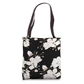 White Magnolias Floral Pattern on a Black Background Tote Bag