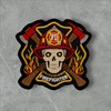 Skull in a Fireman's Helmet Against a Background of fire