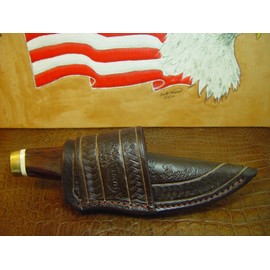 New Buck Vanguard Cross Draw Knife Sheath. Made of 10 Oz Water Buffalo Leather and Has a Rope Pattern Tooling with Random Patterning in the Center of the Sheath. Sheath ONLY!