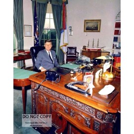 PRESIDENT JOHN F. KENNEDY SITS AT THE "RESOLUTE DESK" - 8X10 PHOTO (ZY-434)