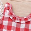 playera sin mangas con lazo y volantes para bebé y