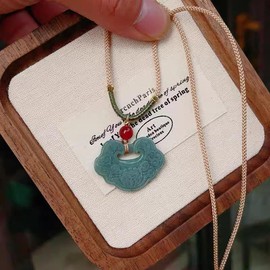 Natural Blue Jadeite Pendant (Lotus and Ruyi Lock Design, Approx. 31×23mm)