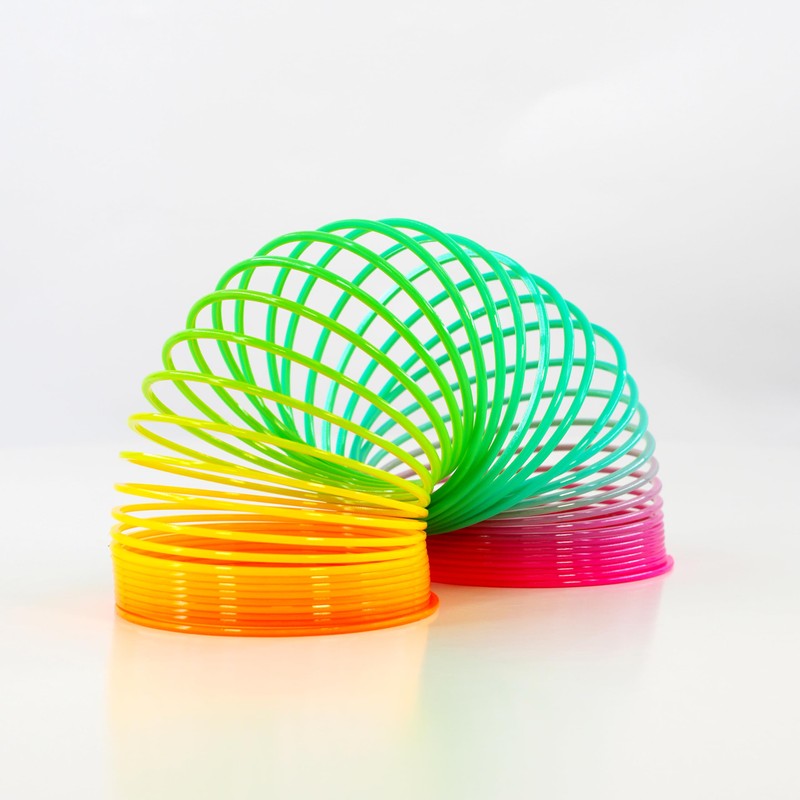 12 x LARGE Rainbow Springs Plastic Magic Slinky Spring Toy