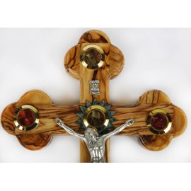 Olive Wood Crucifix/Wall Cross adorned with olive leaves,frankincense,flowers and stones from Jerusalem. Hand Crafted in Bethlehem.Ideal Religious Gift for Christmas or any other Christian Holiday.
