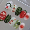 Handmade nail tip for a bear missing a watermelon in