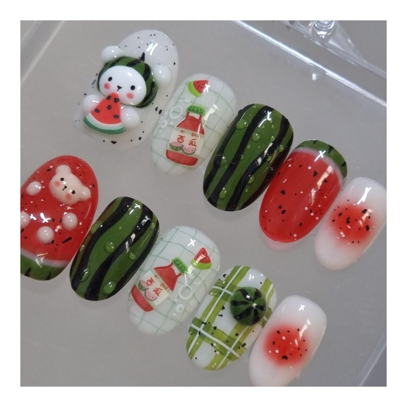 Handmade nail tip for a bear missing a watermelon in
