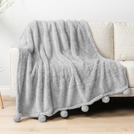 Pavilia Light Grey Sherpa Throw Blanket for Couch, Warm Plush Fuzzy Blanket Throw, Gray Sofa Throw, Lightweight Soft Cozy Fluffy Blanket with Pom Poms, Light Gray, 50x60