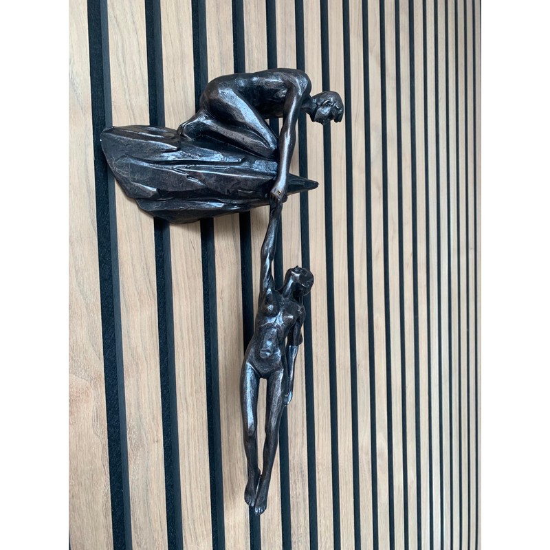 Haute Collage Man on cliff edge holding a hanging woman