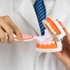 Pack of 4 denture cleaning brushes and 4 pieces interdental