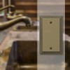 Amerelle Steps Single Blank Cast Metal Wallplate in Rustic Brass