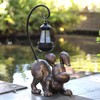Hnnpmm Laughing Dog Figurine with Solar-Powered LED Light 15.9 Inches