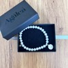 Agálea | Pulsera de Perlas naturales con dije de San