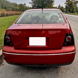 Spec-D Tuning Dark Smoke Lens Glossy Black Housing Tail Brake Lights Compatible with 1999-2005 VW Jetta/Bora MK4 4-door Sedan, Left + Right Pair Assembly