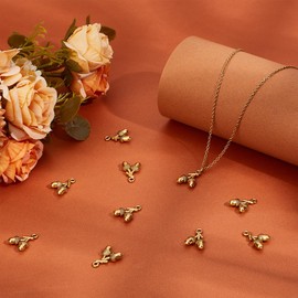 UNICRAFTALE 10Pcs Tibetan Style Alloy Pendants Acorns Charm Antique Golden Pinecone Charms Metal Tree Pendants Gold Earring Charm Small Cute Acorns Dangle Charm for DIY Jewelry Making