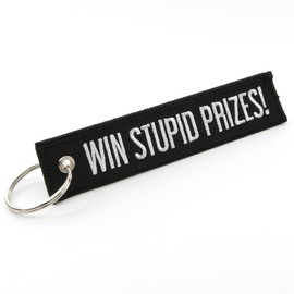 Rotary13B1 PLAY STUPID GAMES - WIN STUPID PRIZES! - Key Chain Jet Tag - Size 1 inch tall x 5 inches wide (Black)