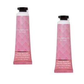 Bath & Body Works Crema De Manos Con Manteca De Karité, Tamaño De Viaje, 1 Onza Líquida, Paquete De 2 (Tostada Con Champán) Brindis Con Champán 1 Onza Líquida (Paquete De 2)