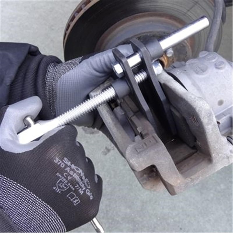 Dedicated tool for pushing the caliper piston back easily when