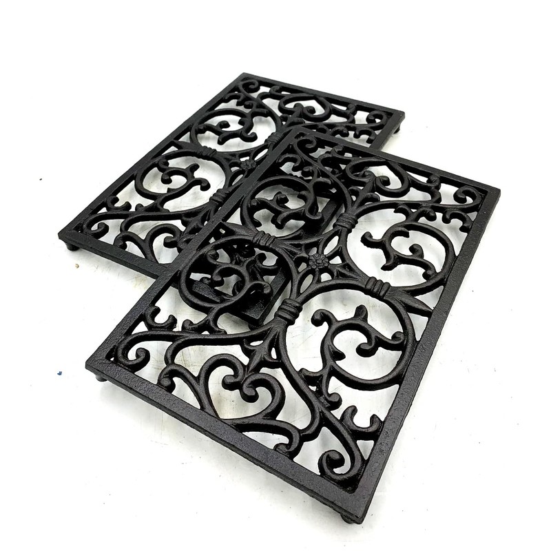 Delightful rectangular decorative cast iron trivet - ideal to protect