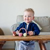 Hape Racing Turtle Rike Rolling Toy with Teether from 10