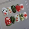 Handmade nail tip for a bear missing a watermelon in