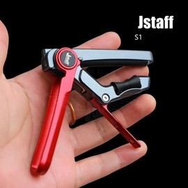 Jstaff S1 The Rolling Capo Rolling Capo - Quick transposition and key changes possible by sliding while attached - 3 levels of force adjustment for secure fixing - Won't damage the neck - Stylish