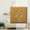 Amerelle Traditional Double Toggle Wood Wallplate in Light Oak
