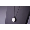 Long chain 'Frieda', 2 Polaris cabochons in a double-sided black