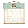 Wooden Refillable Sheltie Calendar Holder filled with a 2025 calendar