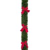 2.7M x 10cm approx Green Tinsel with Red Bows