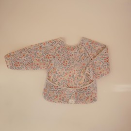 mushie Long Sleeve Baby Bib | Mess Free & Waterproof Fabric for Toddlers | Adjustable Fit for Ages 6-24 Months (Pastel Blooms)