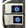 Page & Leaf evil eye pouch