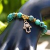 Pulsera con Mano de Fátima (Hamsa) y Flor de Lluvia