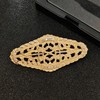 Elegant Gold - toned Oval Shaped Filigree Brooch with Crystal