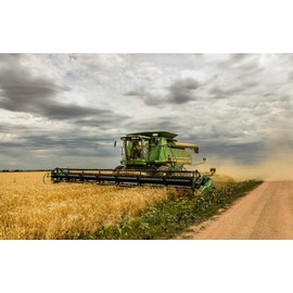 Photo - A harvesting Combine Kicks up dust During its Work in Field Near The Tiny Town of Carpenter in Southeast Wyoming's Laramie County- Fine Art Photo Reporduction 12in x 08in