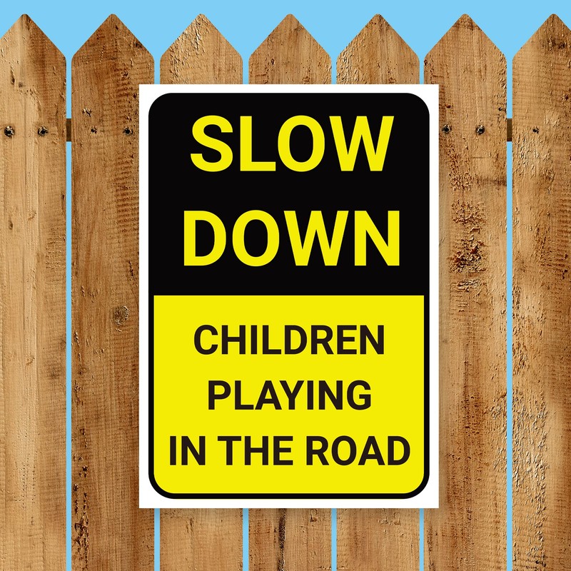 'SLOW DOWN, CHILDREN PLAYING IN THE ROAD' WARNING SIGN. TOUGH,
