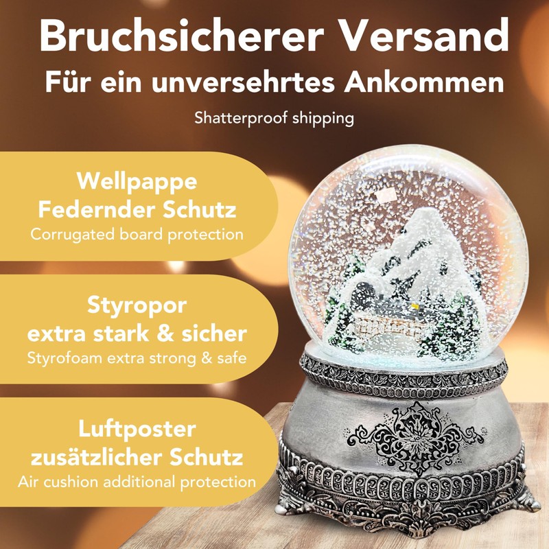 Snow globe mountain landscape with bridge, pewter effect ornaments, with