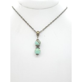 Women's necklace with pendant in reconstituted turquoise beads dyed in blue and Tibetan beads in antique bronze
