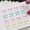 TUKEVA Pack of 150 Butterfly Nails Charms Bow Resin Nail