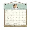 Wooden Refillable Sheltie Calendar Holder filled with a 2025 calendar