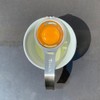 Separador de yema de huevo en acero inoxidable con mango