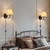 Plug in Wall Sconces with White Fabric Shades, Black Wall