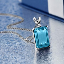 Gem Stone King 925 Silver Swiss Blue Topaz and White Diamond Pendant Necklace For Women (9.72 Cttw, Gemstone November Birthstone, Emerald Cut 14X10MM, with 18 Inch Silver Chain)