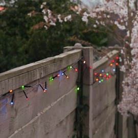 Festive Lights - 10m Solar Power Multi Function Fairy String Lights with 100 Multicoloured LEDs - IP44 Rated, Outdoor Decorative Lighting - External Panel, Black Cable, Garden Trees, Fences & Pergolas