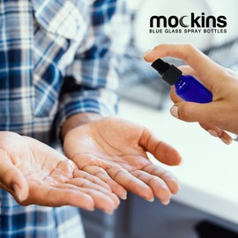 Nevlers 24 Pack Blue 1 Oz Glass Spray Bottle | The Blue Misting Glass Bottles Includes Sprayers & a Funnel and Brush with Bonus Labels to Easily Identify it's Contents