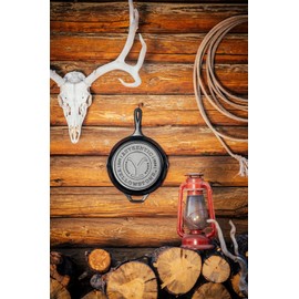 Lodge Pre-Seasoned Yellowstone Stamped Cast Iron Cookware - Signature Teardrop Handle - Use in the Oven, on the Stove, on the Grill, or Over a Campfire - 10.25 Inch Logo Skillet