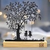 UNUS Decorative Tree Stand, Children on the Swing, Black Metal