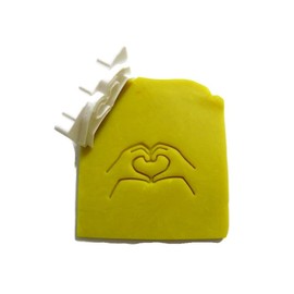 Hands into a heart stamp for many uses soap making and pottery