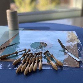 Bobbin Lace Making Kit with Pillow. 23 Inch x 2 Inch Round Lacemaking Board, 24 Danish Lacemaking Bobbins, Bobbin Lace Patterns, Pins, Linen Thread, Crochet Hook, Vinyl Lace Protector, Pin Pusher.