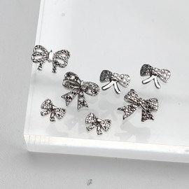 DANNEASY 80pcs 3D Bow Nail Charms: Alloy Silver Bowknot Charms and Rhinestones Crystal Jewels Flat-back Nail Studs Rivet for Crafts Decoration and Jewelry Supplies